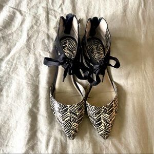 Cute black and white zip and tie flats